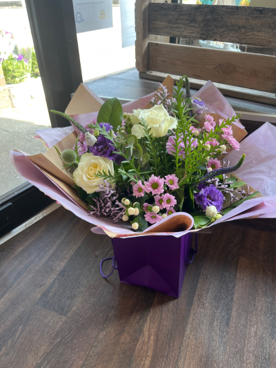 Cool Breeze - This classical stylish collection of flowers, make this hand tied the perfect gift. Flowers professionally arranged and delivered by a local florist.