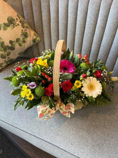Sherbet Twist - This delightful collection of seasonal blooms is a beautiful way to send your affections. A pretty arrangement in a classic basket simply fizzing with joy and character.